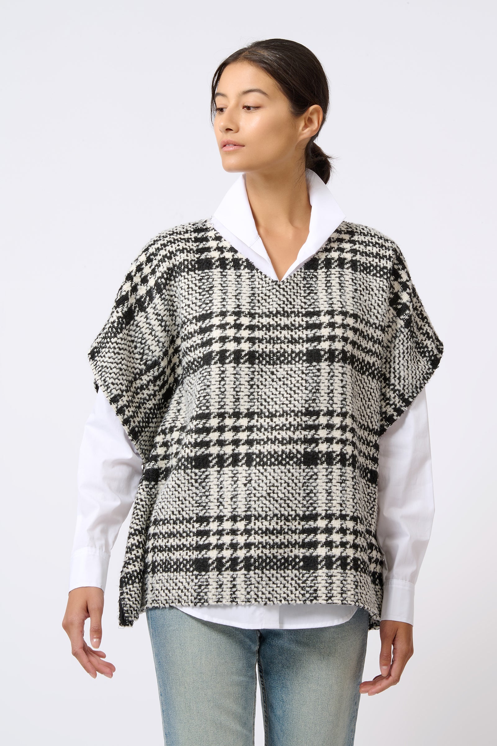 Kal Rieman Plaid Poncho in Black and White Plaid on Model Looking Right Front View