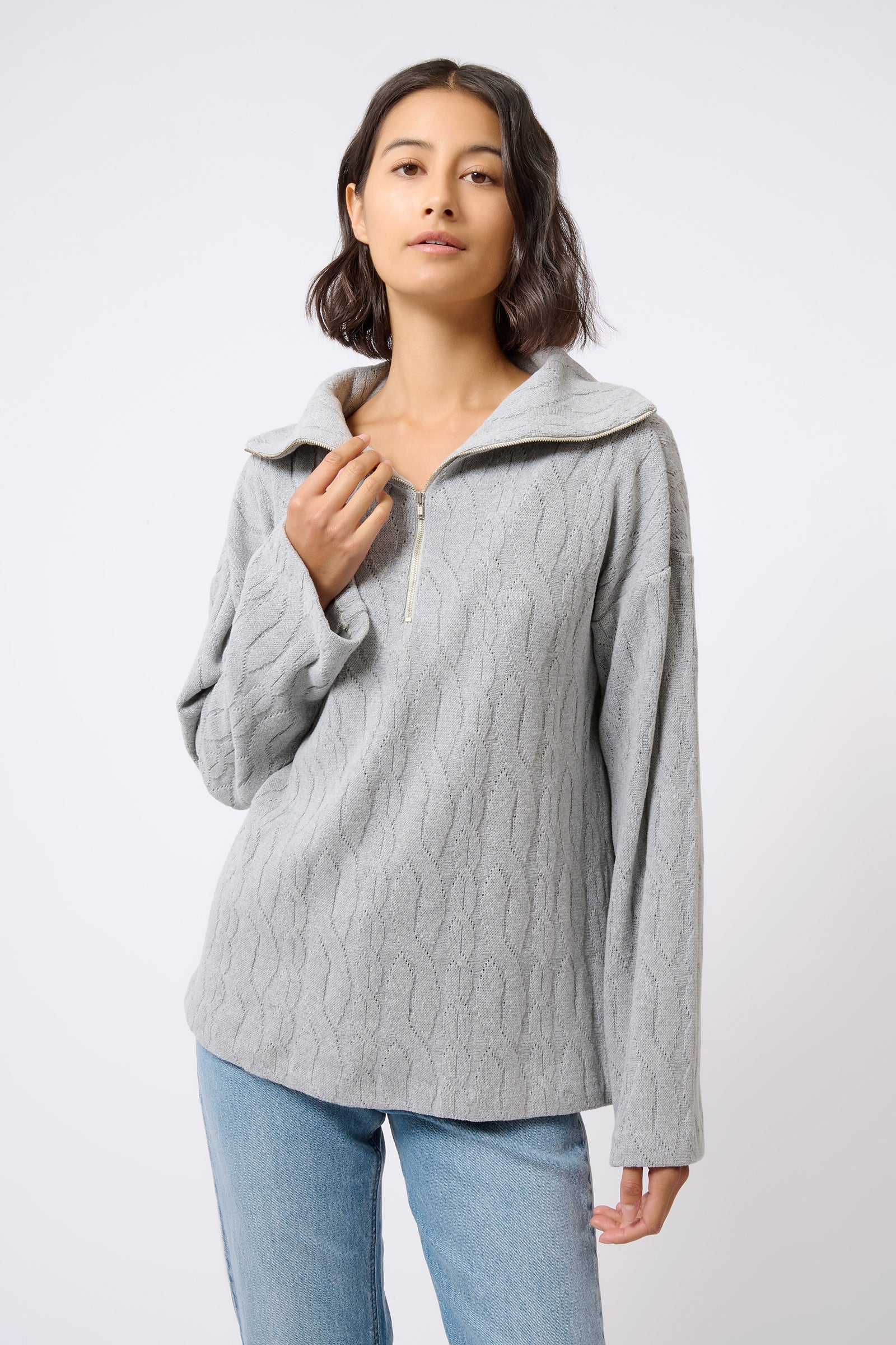 Kal Rieman Sandra Collared Zip Pullover Cable Knit in Grey on Model with Hand on Collar Front View