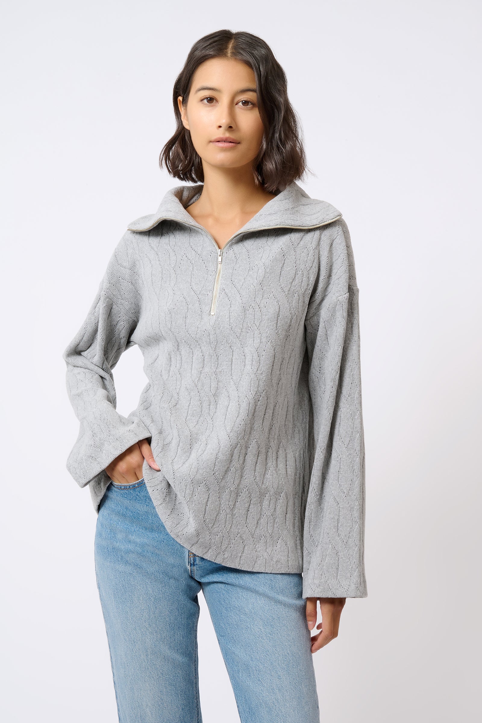 Kal Rieman Sandra Collared Zip Pullover Cable Knit in Grey on Model with Hand in Pocket Front View