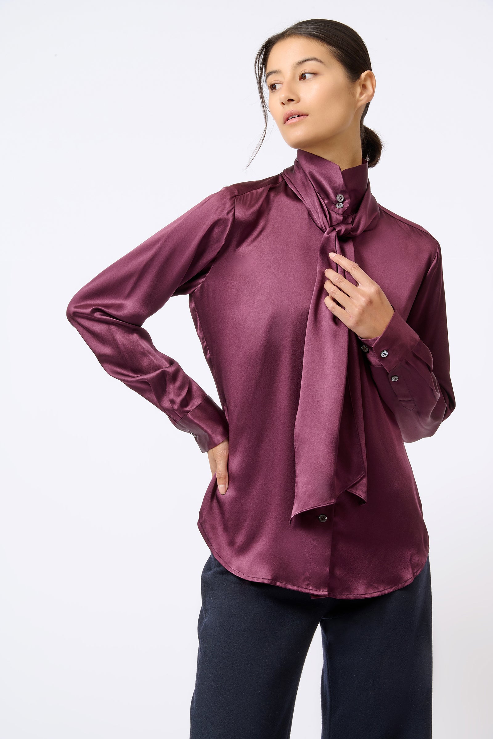 Kal Rieman Scarf Tie Blouse in Bordeaux on Model with Hand on Scarf Front View
